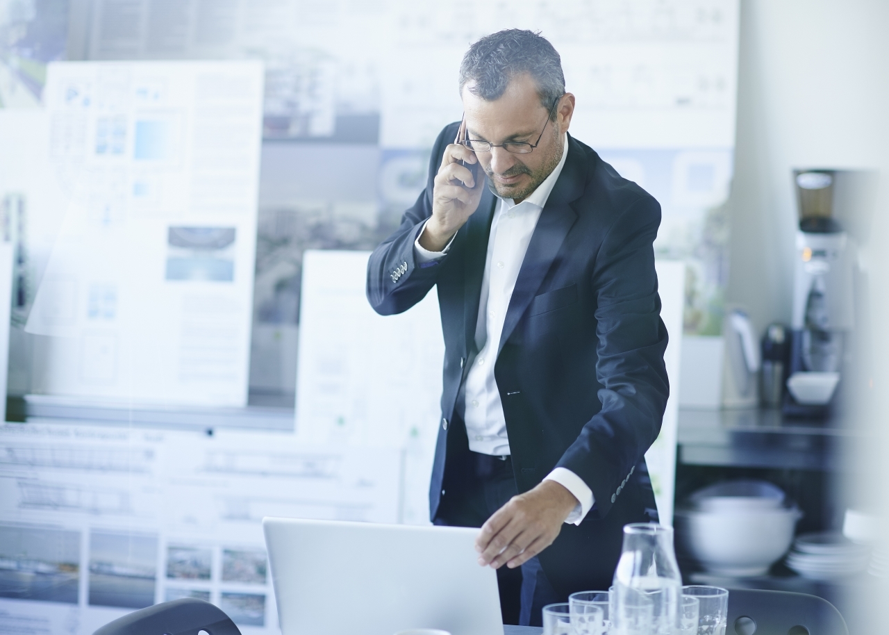 Business man chatting on smartphone 